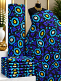Sapphire Orbit African print cotton fabric in blue, turquoise, purple and yellow, featuring bright circular motifs against black; shown draped and folded.