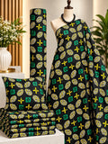 Citrus Mosaic African print cotton fabric in green, yellow, white and black, featuring squares, crosses and circular medallions; shown draped and folded.