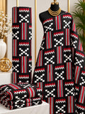 Crimson Crossroads African print cotton fabric in red, black and white, featuring striped panels with cross-like geometric forms; shown draped and folded.