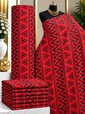 Scarlet Angles African print cotton fabric in red and black, featuring repeating triangles and zigzag bands; shown draped and folded.