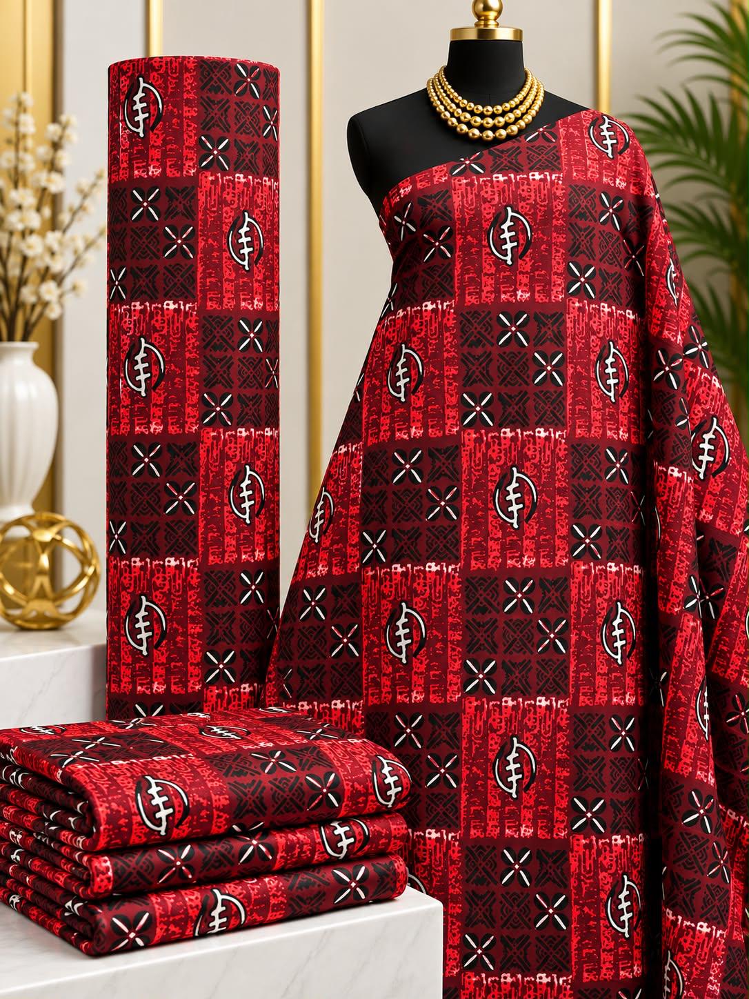 Garnet Grid African print cotton fabric in red, black and cream, featuring checkerboard panels with small angular line motifs; shown draped and folded.