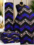 Violet Chevron African print cotton fabric in blue, purple, black and gray, featuring broad zigzag bands with contrasting mottled sections; shown draped and folded.