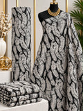Silver Current African print cotton fabric in black and white, featuring densely patterned winding ribbon-like stripes; shown draped and folded.