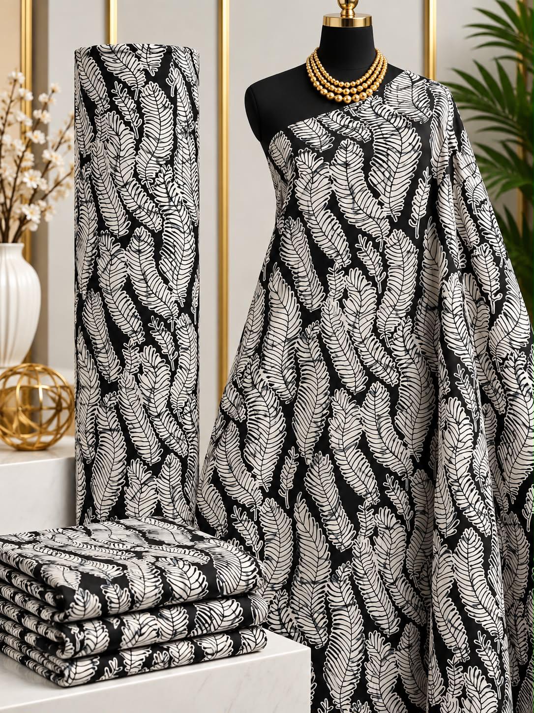 Silver Current African print cotton fabric in black and white, featuring densely patterned winding ribbon-like stripes; shown draped and folded.