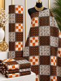 Cocoa Checker African print cotton fabric in brown, orange, cream and black, featuring patchwork squares with checks and small ornamental details; shown draped and folded.