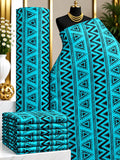 Lagoon Angles African print cotton fabric in turquoise and black, featuring vertical rows of triangles and zigzag details; shown draped and folded.