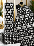 Midnight Notation African print cotton fabric in black and white, featuring horizontal rows of small geometric and abstract marks; shown draped and folded.