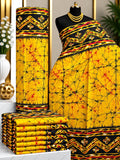 Solar Border African print cotton fabric in yellow, orange, green and black, featuring fine branching marks framed by contrasting ornamental borders; shown draped and folded.