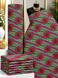 Jade Rosettes African print cotton fabric in green, pink and black, featuring diagonal rows of circular ornamental medallions; shown draped and folded.